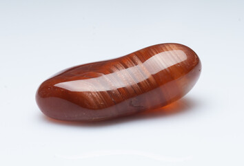 Natural stone carnelian on a white background