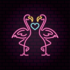 Neon sign two flamingos in love with a heart between