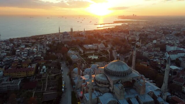 The first rays of the sun illuminate the ancient city of Stabul (Constantinople). Aerial view of Hagia Sophia mosque