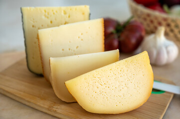 Cheese collection, French fol epi  cheese with many little holes, etorki, tomme noire des pyrenees and ossau iraty cheese