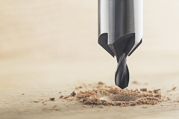 Countersink drill bit make sink in hole for screw in wooden oak plank