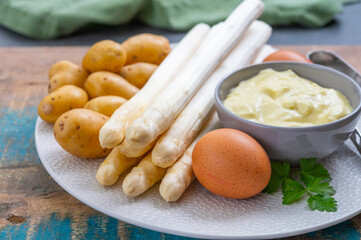 Ingredients for spring vegetarian dinner, high quality Dutch white asparagus, washed and peeled on...