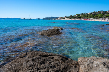 Summer vacation on French Riviera, crystal clear azure blue water of  Mediterranean sea in Saint Clair near Le Lavandou, Var, Provence, France