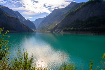 Blue mountain lake Lac Chambon in French Alps in summer