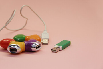 Fototapeta premium color USB adapter and green flash drive on a light background