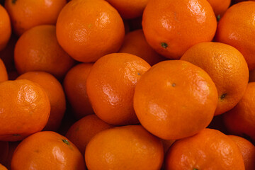 Fresh mandarin oranges fruit or tangerines, as background, background. Selective focus