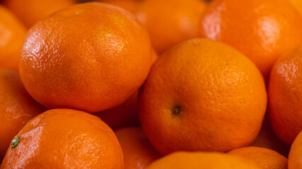 Fresh mandarin oranges fruit or tangerines, as background, background. Selective focus