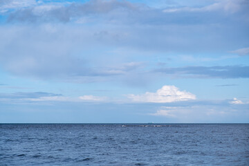 Obraz premium the Baltic sea looks so very blue and there are some white clouds