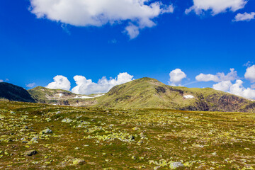 Amazing Norway norwegian landscape boulders at summit top of mountain.