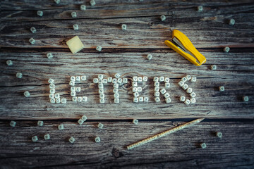 Alphabet letters on wooden square pieces forming the word "letters"