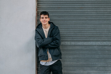 young urban teenager in casual style on the street outdoors