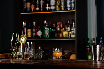Empty top of wooden counter bar and blurred bottles. Background for your product display. empty bar...