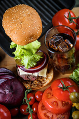 Delicious burger. Still life of vegetables and hamburger.