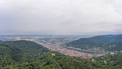 Fototapeta na wymiar Aerial drone shot of Heidelberg from Konigstuhl hill in overcast summer morning