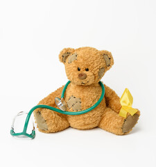 brown teddy bear with a patch,  silk yellow ribbon in the shape of a loop
