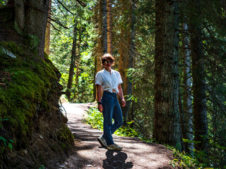 Young girl in the woods. The beauty of nature and the beauty of man.