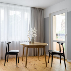 Simple dining area in bright room