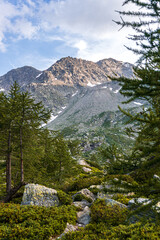 The mountains of the Aosta Valley at sunset seen from the shores of Lake Arpy, near the town of La Thuile, Italy - August 2020.