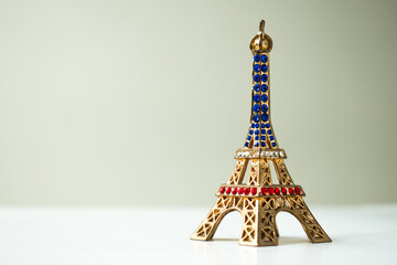 Colorful Eiffel tower on a lighted surface 