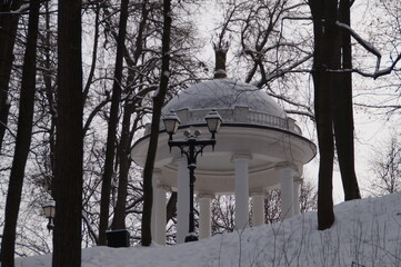White gazebo in a snow-covered park