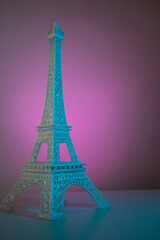 Fototapeta na wymiar Colorful Eiffel tower on a lighted surface 