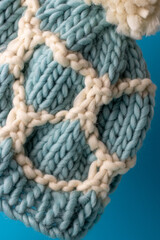 soft and cosy hand knitted hat in blue and white chunky wool 