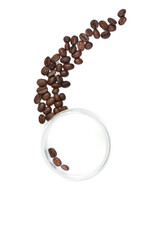 A glass of milk with coffee beans inside and a little outside. View from above. Isolated