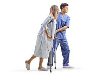 Male doctor helping a female patient with crutches © Ljupco Smokovski