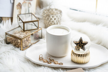 Beautiful home decorations with candle and star on white tray