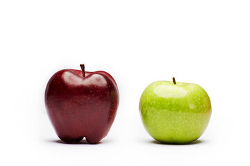 Two raw fresh clean red and green apples isolated on the bright solid fond plain white background