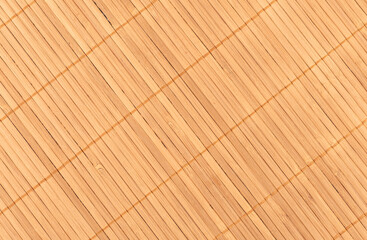 Full frame close-up shot of a bamboo food mat diagonal.