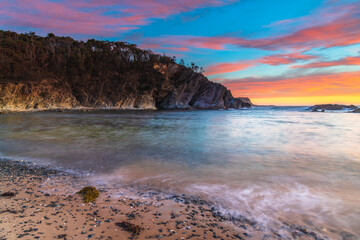 Colourful High Cloud Sunrise Seascape and Rock Formations