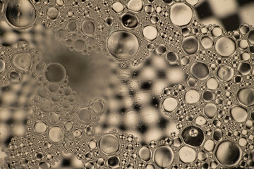 Black and White Oil and Water Abstract Photo. Different sized circles of black, white and grey.