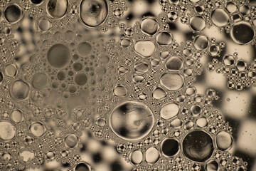 Black and White Oil and Water Abstract Photo. Different sized circles of black, white and grey.