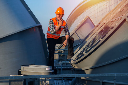  Engineer People Service On Cooling Tower Check Belt And Fan Blade. Cool ,construction,engineer,site,management,safety,civil,workers