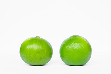 Green lemon with white background.