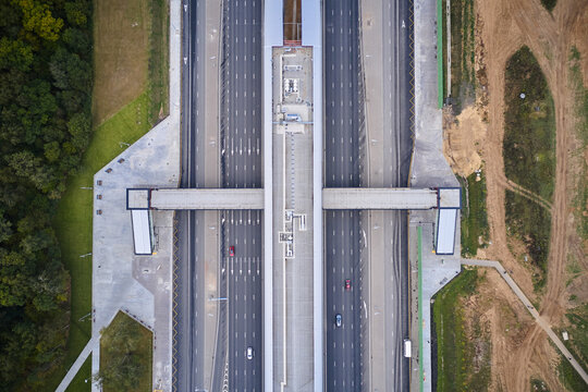 Pedestrian Bridge Over The Highway. Aerial Top Down View