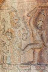 Hampi, Karnataka, India - November 5, 2013: Vijaya Vitthala Temple. closeup of brown stone Narasimha with dancing partner in Mandapam.