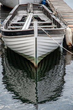 Small Sailboat Moored On Dock.