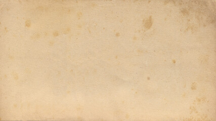 Old paper vintage brown or beige retro design background with damaged, weathered dirty surface. A rustic grungy textured material like a blank horizontal parchment page, an empty manuscript texture