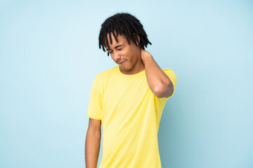 Young african american man isolated on blue background with neckache