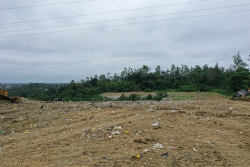 Aerial footage of a garbage landfill, showing the trash piled up