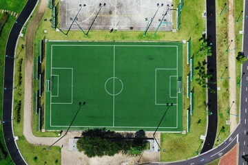 Midpoint of an artificial grass football field zooming out to reveal the field © pangamedia