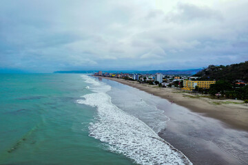 Fototapeta premium Aerial view, following a beach with many waves