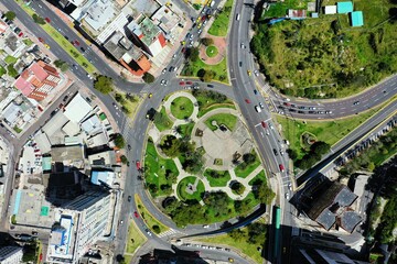 Aerial top down view of a large and busy roundabout in Quito, Ecuador