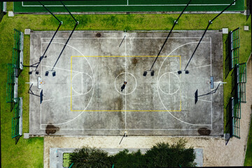 Top view still video of a basketball field while clouds are moving over