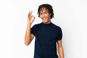 Fototapeta premium Young african american man isolated on white background showing ok sign with fingers