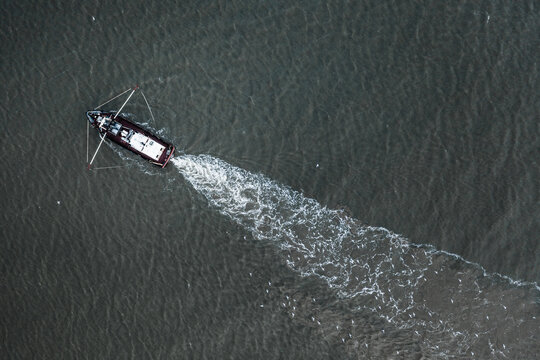 Aerial view of a fishing boat in the North Sea at Terschelling, Friesland, The Netherlands.
