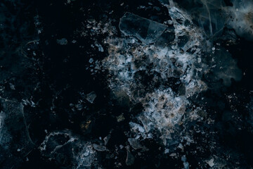 broken blue ice on the ground
