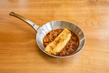 cod callus omelette in stainless steel pan